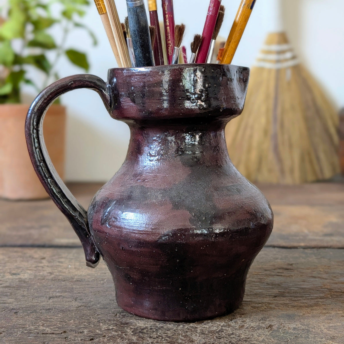 Dark Glossy Glazed Stoneware Jug with Paintbrushes