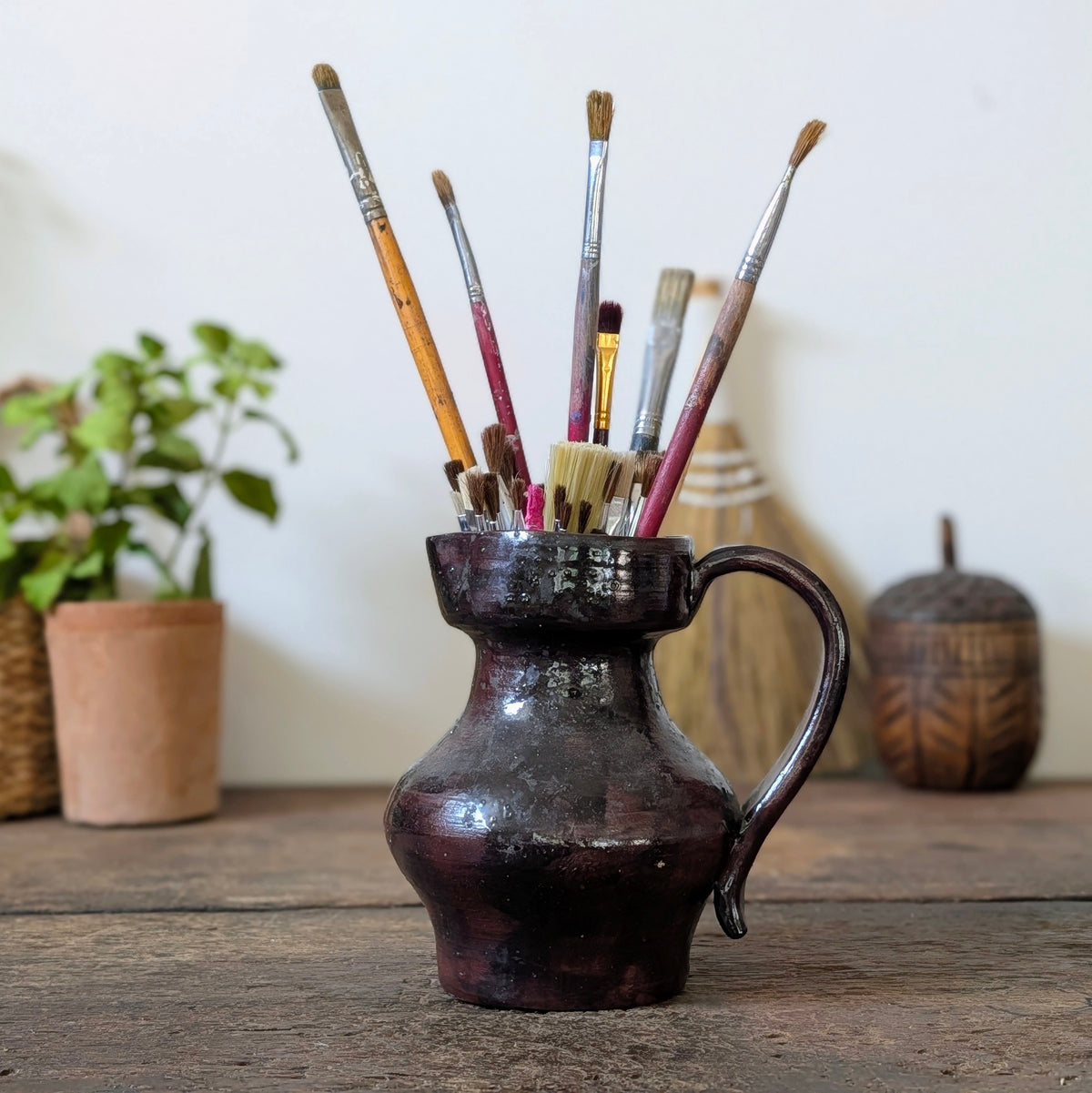 Dark Glossy Glazed Stoneware Jug with Paintbrushes