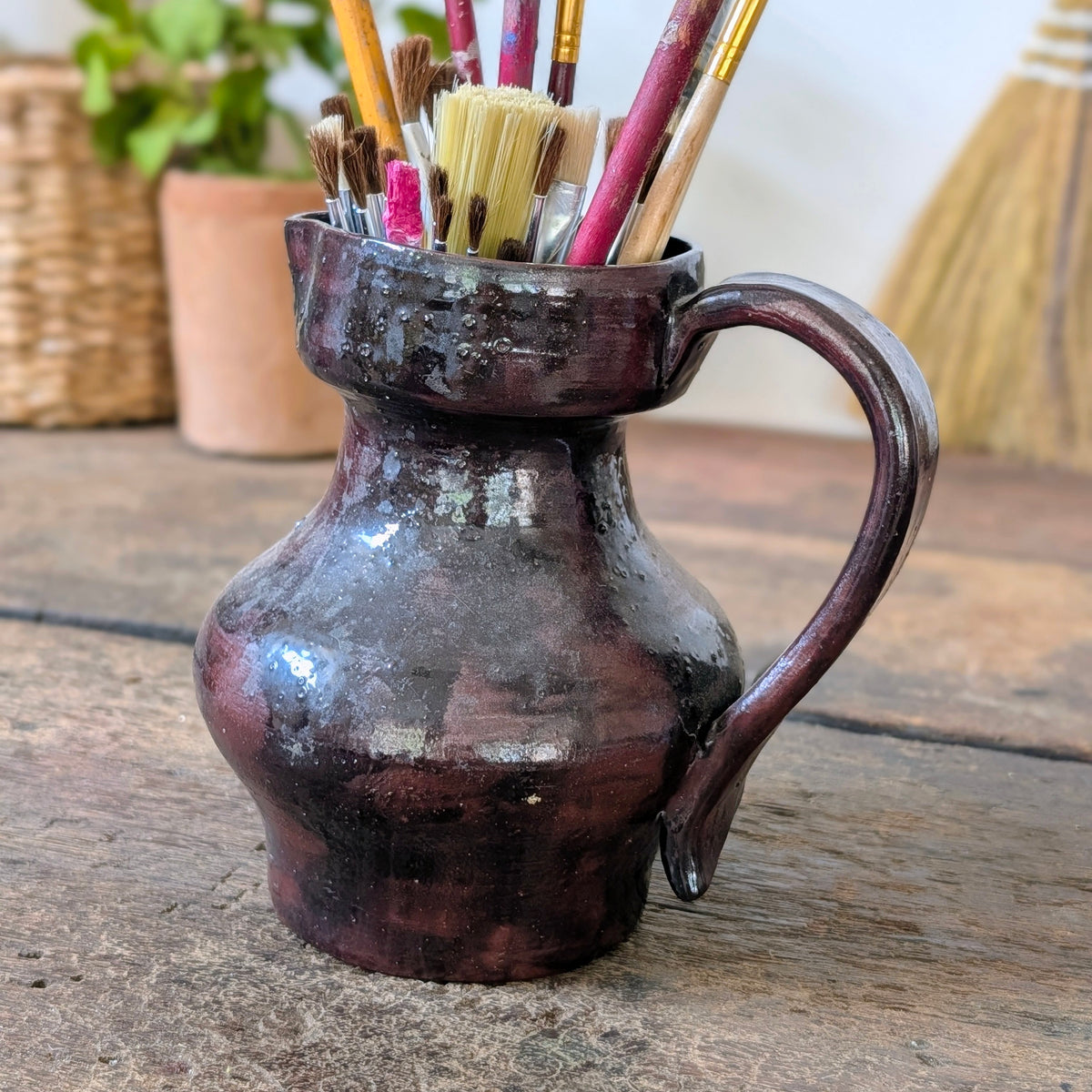 Dark Glossy Glazed Stoneware Jug with Paintbrushes